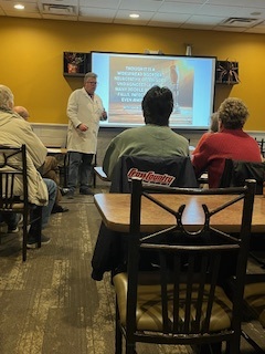 Dr. Daniel Larsen presenting at a chiropractic continuing education seminar
