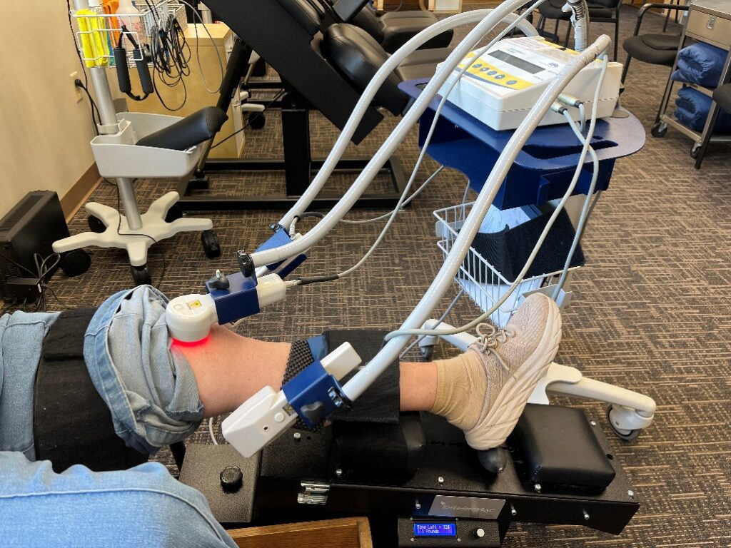 Advanced laser therapy equipment used for pain relief at Twin Cities Chiropractic Spine and Injury Center