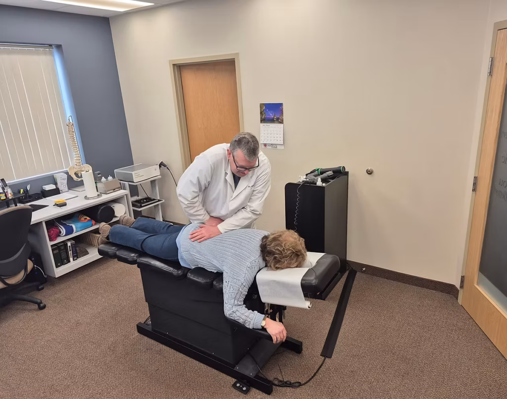 Dr. Larsen performing a chiropractic spinal adjustment at Twin Cities Chiropractic Spine and Injury Center